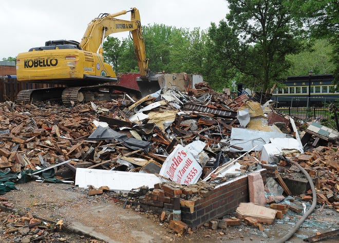 The building at the corner of Franklin and Erie streets in Kent that housed Ramella's Pizza and Mugs Brew Pub has been razed to make way for a six-story building that will house a restaurant, bakery and apartments.