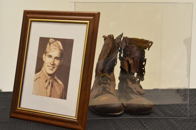 A pair of jump boots belonging to the late 2nd Lt. Frederick G. Humphrey, a World War II paratrooper, are unveiled at Fort Bragg as part of All American Week. The boots were recently returned to the U.S. after being in the possession of a Dutch family for nearly 74 years. [Spc. John Lytle/U.S. Army]