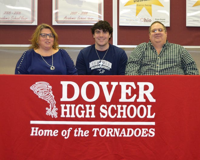 Dover senior Kyler Dickey, who is seated between his mother, Dianne and father, Lyle recently announced his intention to continue his education and track career at Mount Vernon Nazarene University. Technically a “walk-on” his first year at MVNU, Dickey will be eligible for athletic scholarship money in his sophomore year based on academic and athletic performance standards from his freshman year. MVNU is a member of The Crossroads League which is an athletic conference composed of NAIA, Division II, private Christian colleges in Indiana, Michigan and Ohio. While at MVNU, Dickey plans to major in Physical Therapy. Dickey has been a three year letter winner and a three sport athlete for the Crimson Tornadoes, participating in football, basketball and his favorite sport, track. Dickey has enjoyed an exception career as both a shot put and discus thrower where he has been Division I regional qualifier each of the past two years. In his junior year, Dickey was a Northeast District champion last year at North Canton as well as East District "Athlete of the Year" in field events. As a senior, Dickey earned Dover’s “High Point Award” with 136 points as well as the teams “Most Outstanding Performer." "Kyler's success in Track is a result of his dedication," said Dover head track and field coach Tim Smith. "He has spent a great deal of time learning about the technical aspects of the shot and discus events, and he is willing to put in the training time needed to improve his skills." Dickey will be competing in the regional at Pickerington North tonight and Friday. In addition, Dickey will be presented his Dover High School diploma at Friday’s track meet as the meet conflicts with the DHS commencement ceremony. Submitted photo