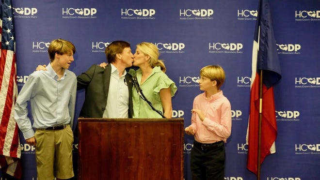 Andrew White kisses his wife, Stacey, after conceding defeat Tuesday night in the Democratic gubernatorial runoff. KEN HERMAN / AMERICAN-STATESMAN