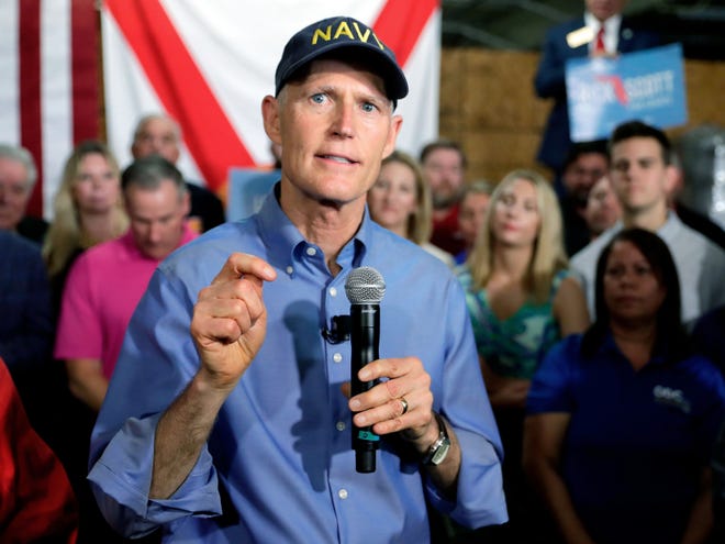 "The integrity of our elections is paramount, and we'll keep fighting to ensure that every Floridian continues to have confidence in our elections process," Gov. Rick Scott said in a statement regarding election security grant money. [AP Photo/John Raoux]