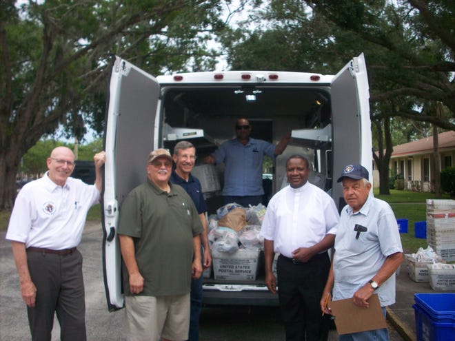 The Social Services Food Pantry at Prince of Peace Catholic Church was the recipient of food May 12 from the Annual National Association of Letter Carriers "Stamp Out Hunger" Food Drive. Pictured are members of Knights of Columbus Prince of Peace Council 8791 who helped unload, sort and stock the food as it arrived. Many other parishioners also assisted in this annual project. [Photo provided]