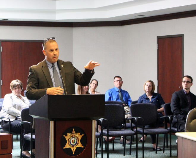 Lt. Andy Fias gives a report about the West Michigan Enforcement Team's 2017 activities to the Ottawa County Board of Commissioners on Tuesday, May 22 in West Olive. [Audra Gamble/Sentinel staff]