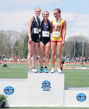 Grand Valley State's Jenna Klynstra, middle, won the 5,000-meter run at the GLIAC Championships. She's joined on the podium by teammate Madison Goen (left) and Ferris State's Kathryn Etelamaki, who finished 2-3. [Courtesy/Grand Valley State Athletics]