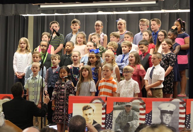 The Tussing Elementary School Choir performs three musical selections at the Hometown Heroes Recognition Ceremony held on Tuesday. [Kelsey Reichenberg/progress-index.com]
