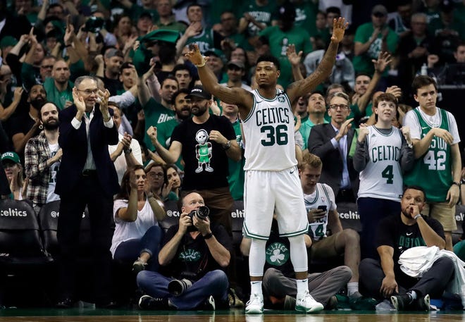 Marcus Smart celebrates near the end of Game 5.