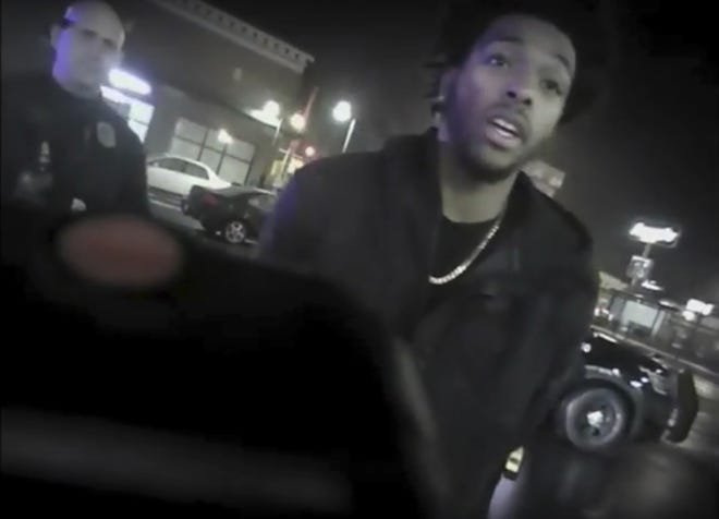 This Jan. 26, 2018 police body-camera footage released by Milwaukee Police Department shows NBA Bucks guard Sterling Brown as he talks to arresting police officers after being shot by a stun gun in a Walgreens parking lot in Milwaukee. The release comes as city officials who've viewed the videos have expressed concern about how officers conducted themselves. Even leaders of the police department have hinted the video may make them look bad. (Milwaukee Police Department via AP)