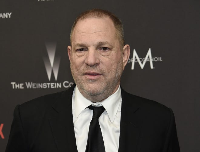 FILE - In this Jan. 8, 2017, file photo, Harvey Weinstein arrives at The Weinstein Company and Netflix Golden Globes afterparty in Beverly Hills, Calif. Law enforcement officials say Weinstein is expected to surrender to authorities Friday morning to face criminal charges in a months-long investigation into allegations that he sexually assaulted women. The officials say the charges relate to related to a former actress, Lucia Evans, who said Weinstein assaulted her in his New York offices in 2004. (Photo by Chris Pizzello/Invision/AP, File)