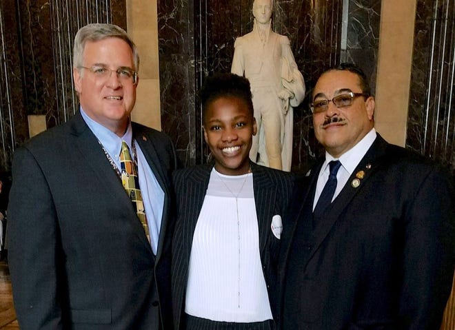 Breayana Bradley, a Tulane student who went through the state’s foster care system, and Rep. Kenny Cox, D-Natchitoches, right, posed with state official Chip Coulter after Cox gave Bradley a scholarship.