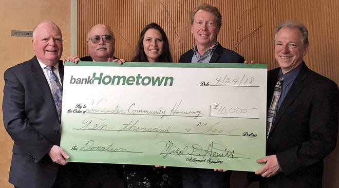 Pictured are, from left, bankHometown's Michael Hewitt, president and CEO, Gil Ehmke, EVP/CFO, Barbara Yanke, residential lending manager, and Michael Roy, CRA officer, and Dominick Marcigliano, executive director, Worcester Community Housing Resources. SUBMITTED PHOTO
