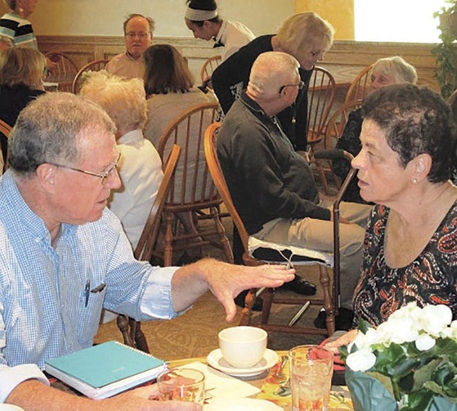 Money Manager Volunteers Annettee Bakstran and Gene Farrell enjoy conversation before dinner is served. SUBMITTED PHOTO