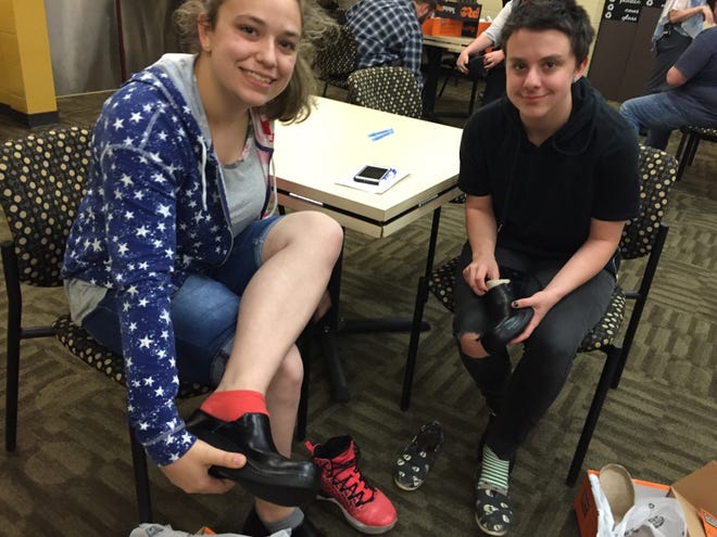 Barbara Lemieux, of Seabrook, and Raymond Townsend, of Exeter, are graduating seniors in the culinary program at SST. They received clog style work shoes from Timberland. [Lara Bricker photo]