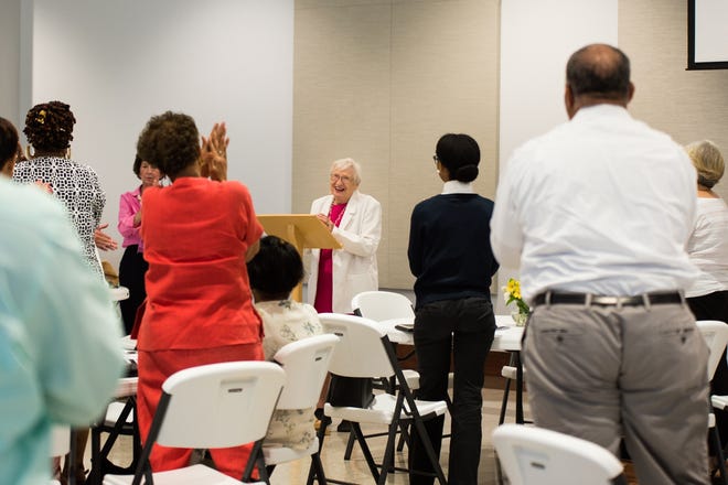 Reverend Lucy Dorr receives a standing ovation at a talk about addressing homelessness at St. Joseph Catholic Church in Petersburg on May 24, 2018. [Geneva Heffernan/progress-index.com]