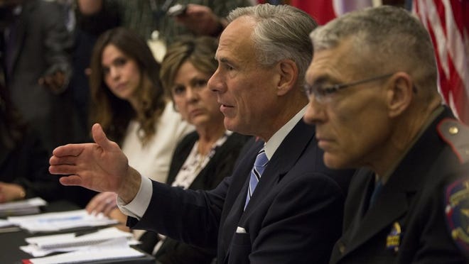 Gov. Greg Abbott hosts a roundtable discussion about safety in Texas schools on Tuesday in Austin.