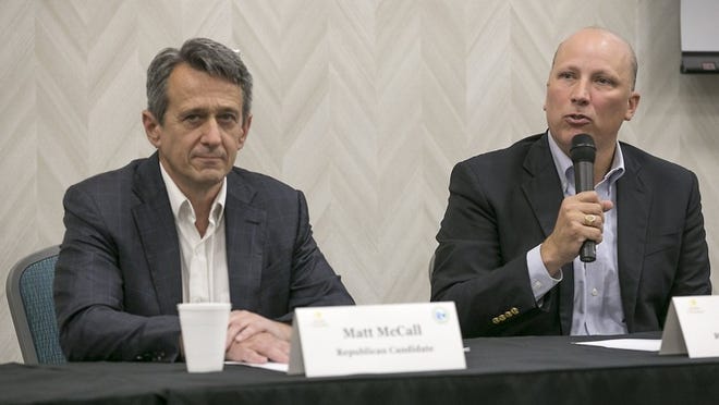 Republican Chip Roy, right, speaks in a candidate forum for the 21st Congressional District race in San Marcos on May 2. Fellow Republican candidate Matt McCall, left, listens during the forum. RALPH BARRERA / AMERICAN-STATESMAN