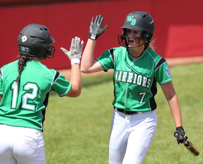 West Branch's Grace Heath (7) high fives with Destany Blake (12) after Heath scored during the sixth inning of the Division II regional semifinal game against Perry at Firestone Stadium in Akron on Wednesday, May 23. West Branch won 3-1.