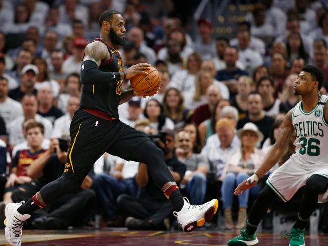 Cleveland Cavaliers' LeBron James (23) drives as Boston Celtics' Marcus Smart (36) defends during the second half of Game 6 of the NBA basketball Eastern Conference finals Friday, May 25, 2018, in Cleveland. (AP Photo/Ron Schwane)