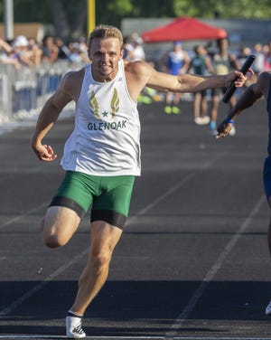 GlenOak's Tate Rhoads anchors the 4 x 100 meter relay to qualify the team for state at Austintown Fitch on Friday, May 25, 2018. (CantonRep.com / Bob Rossiter)