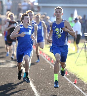East Canton's Josh Conrad won the boys 800 meters during the D3 regional track meet at Perry on Friday, May 25, 2018. At left is Gilmour Academy's Tim Diemer who finished second. (CantonRep.com / Scott Heckel)