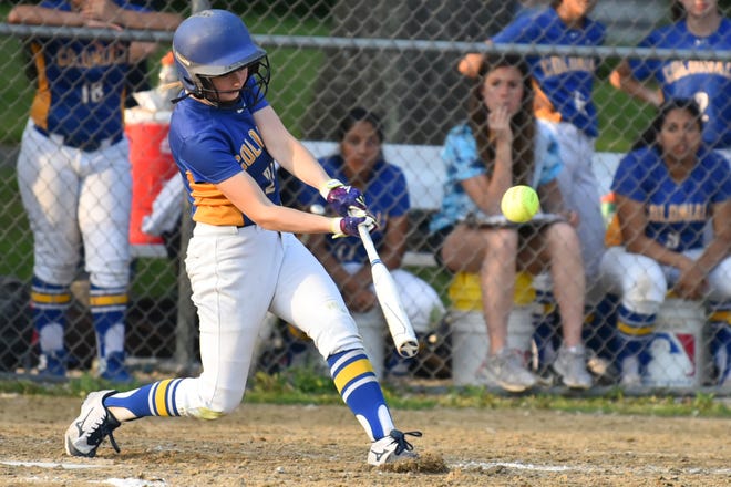 Acton-Boxborough senior Kylie Frank hits a single to the outfield during Friday's varsity softball game against Norton in Acton. [Wicked Local photo/Jeff Porter]