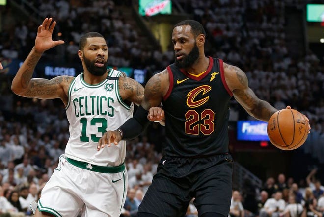 Cleveland Cavaliers' LeBron James (23) drives against Boston Celtics' Marcus Morris (13) during the first half of Game 6 of the NBA basketball Eastern Conference finals Friday, May 25, 2018, in Cleveland. (AP Photo/Ron Schwane)