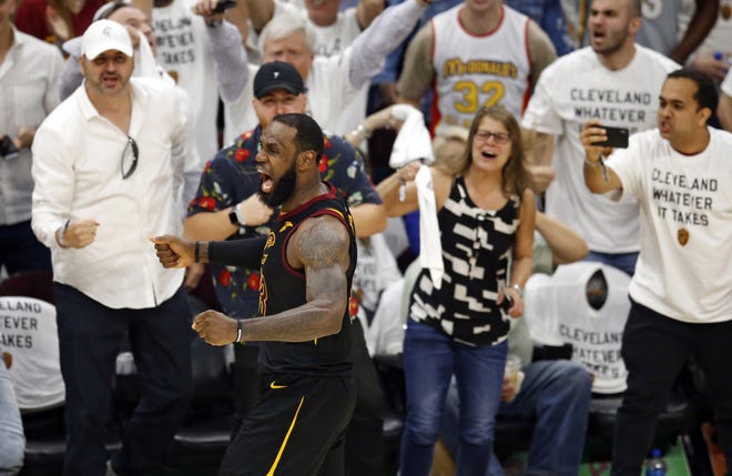 Cleveland Cavaliers' LeBron James reacts after making a 3-point shot during the second half of Game 6 of the team's NBA Eastern Conference finals against the Boston Celtics on Friday in Cleveland. [AP Photo / Ron Schwane]