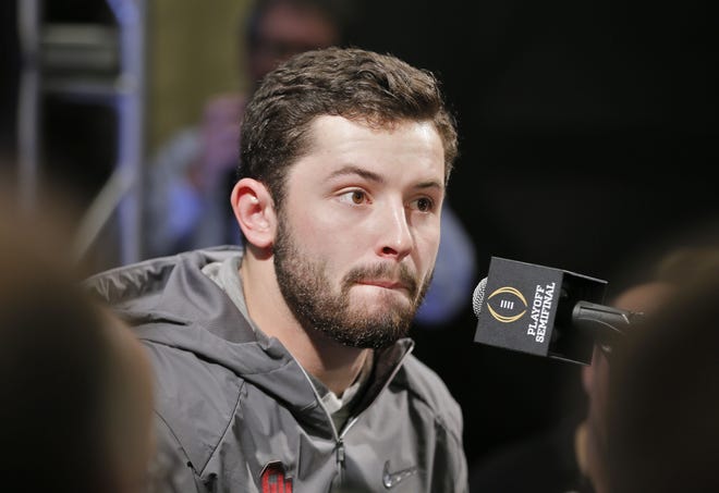Oklahoma quarterback Baker Mayfield answers questions during his team's media appearance, Saturday, Dec. 30, 2017. Mayfield participated in team media day activities after arriving late to the event. He reportedly has been recovering from the flu over Christmas break. He missed the trip to Disneyland on Wednesday with the illness and another event on Friday. Oklahoma plays Georgia in an NCAA college football semifinal playoff game at the Rose Bowl on Monday, Jan. 1, 2018. (Bob Andres/Atlanta Journal-Constitution via AP)
