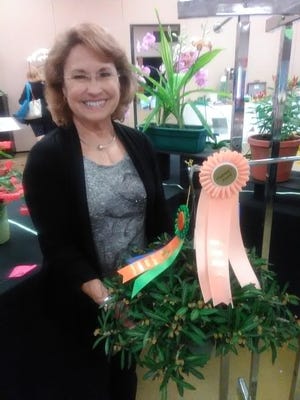 Garden Club of St. Augustine member Dottie Hudson shows off her ribbon at the Annual Flower & Garden Expo April 21. [Contributed]