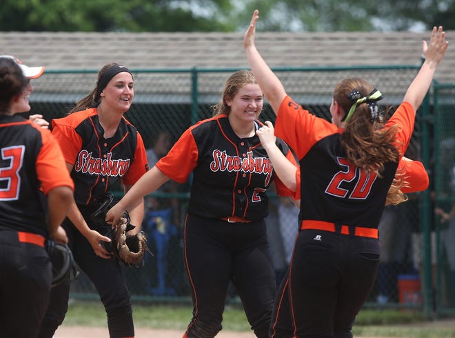 Strasburg pitcher Zoey Thomas (2) prepares for a hug from Brooke Spinell (20) as teammate Emma Clark (9) joins in after the Tigers beat Danville to claim the Division IV regional championship, and earn a trip to the state tournament, Saturday at Pickerington.(TimesReporter.com / Pat Burk)
