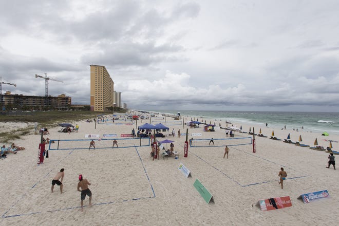 The Extreme Volleyball Professionals tour is played near Russell-Fields Pier on Saturday. The tournament had a few rain delays, but the nothing major says Ed Adams, the tour's production manager. [JOSHUA BOUCHER/THE NEWS HERALD]