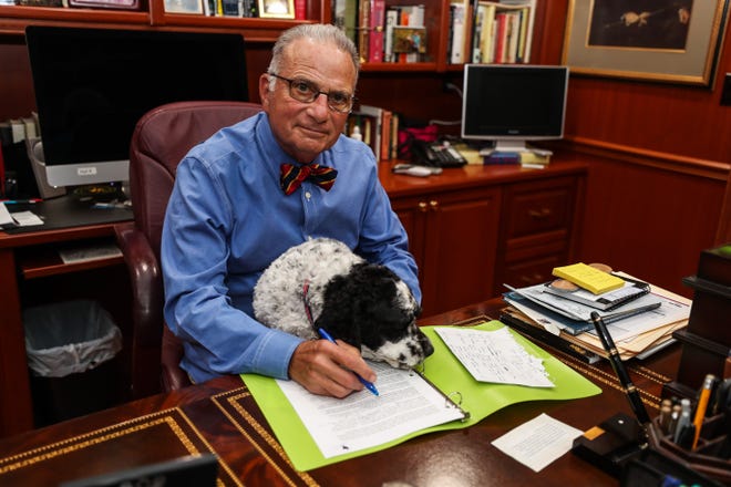 Hal Kushner sits with his dog Maddie at his office in his home in Daytona Beach on Wednesday, May 23, 2018. Kushner will serve as keynote speaker Monday afternoon for the Memorial Day ceremonies at the Vietnam Veterans Memorial in Washington, D.C. [News-Journal/Lola Gomez]