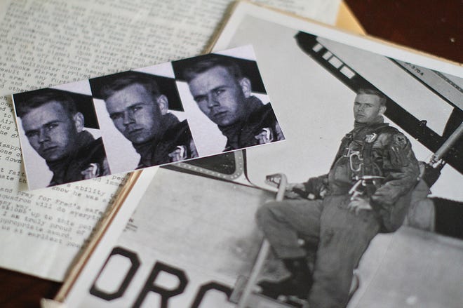 Photos of Air Force Lt. Col. Fred Mellor and a letter he wrote to his wife. He ejected from his plane over North Vietnam, and he has been missing in action ever since. [The Providence Journal / Glenn Osmundson]