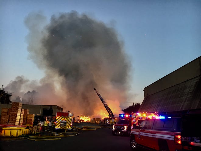 Crews respond Sunday evening to a fire at the Whitsell wood products manufacturing plant in Saginaw. [Andy Nelson/The Register-Guard] - registerguard.com