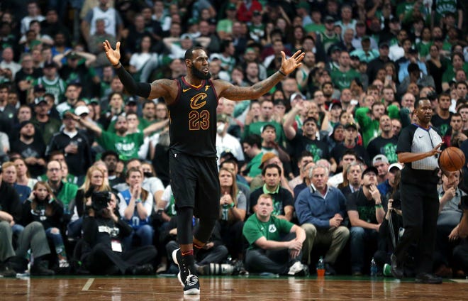 Cleveland Cavaliers forward LeBron James gestures to the crowd Sunday night during the second half of Game 7 of the NBA Eastern Conference finals against the Boston Celtics in Boston. (AP Photo/Elise Amendola)