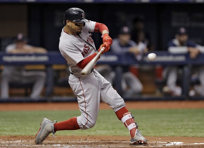 Red Sox outfielder Mookie Betts was a late scratch for Sunday's game against the Atlanta Braves after hurting himself during batting practice at Fenway Park. [CHRIS O'MEARA/THE ASSOCIATED PRESS]