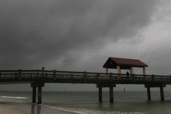 Rain falls on Clearwater Beach by Pier 60 early Sunday morning as northbound Subtropical Storm Alberto looms in the gulf to the southwest. [Jim Damaske/Tampa Bay Times via AP]