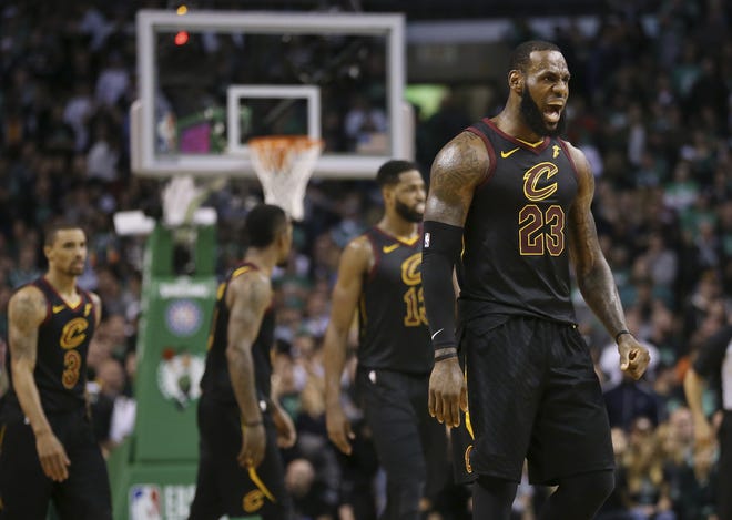 Cleveland Cavaliers forward LeBron James, right, celebrates a basket during the second half in Game 7 of the NBA basketball Eastern Conference finals against the Boston Celtics, Sunday, May 27, 2018, in Boston. (AP Photo/Elise Amendola)
