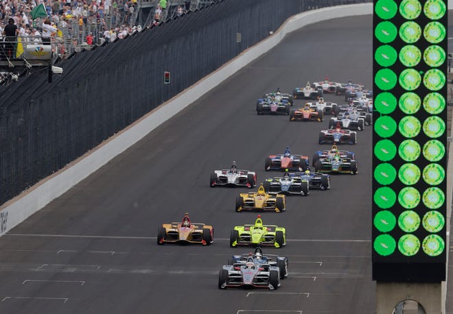 Will Power, of Australia, leads the field on a restart late in the Indianapolis 500 auto race on his way to wining at Indianapolis Motor Speedway in Indianapolis, Sunday, May 27, 2018. (AP Photo/R Brent Smith)