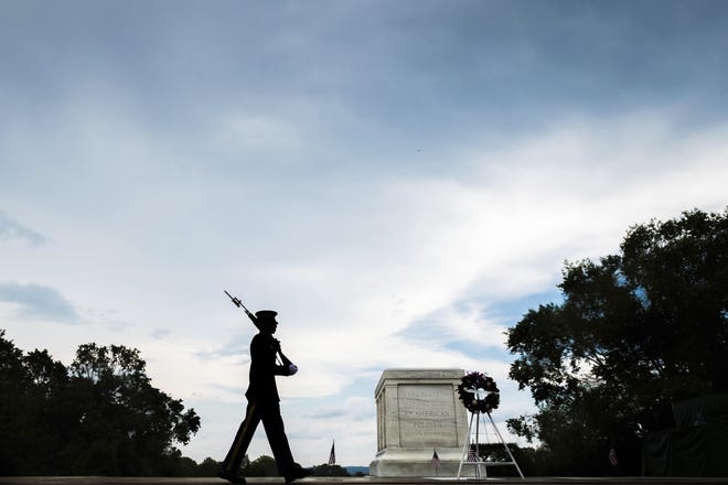 A member of the U.S. Army 3rd Infantry Regiment walks his post in front of The Tomb of the Unknown Soldier in Arlington National Cemetery during the Memorial Day weekend in Arlington, Va., Sunday, May 27, 2018. (AP Photo/J. David Ake)