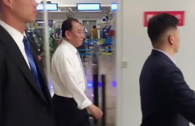 In this image made from video, Kim Yong Chol, center , a former military intelligence chief who is now Kim Jong Un's top official on inter-Korean relations, walks upon arrival at Beijing airport in Beijing Tuesday, May 29, 2018. He was at North Korean leader Kim Jong Unâ€™s side at the table in last weekendâ€™s North-South summit, and had been a prominent senior official in other important talks. It was not possible to confirm the reason for his visit to Beijing, or if he would be traveling on to another destination. (AP Photo)