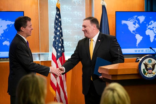 Secretary of State Mike Pompeo releases the annual U.S. assessment of religious freedom around the world, at the State Department in Washington, Tuesday, May 29, 2018. He is joined by Ambassador-at-Large for International Religious Freedom Sam Brownback. (AP Photo/J. Scott Applewhite)
