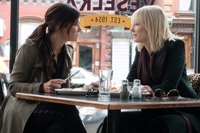 Debbie (Sandra Bullock) goes over some heist details with Lou (Cate Blanchett). [Warner Bros. Pictures]