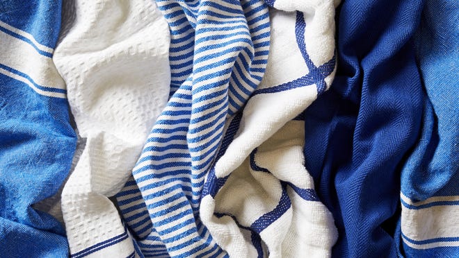 Buy a few dishtowels in different fabrics — perhaps microfiber, flour sack, waffle weave or terry — to see what works best for you. [The Washington Post / Stacy Zarin Goldberg]