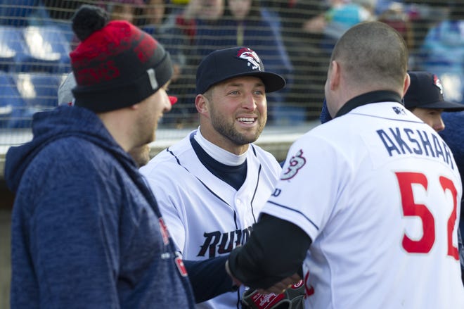 Tim Tebow talks to players in the dugout during his debut with the Binghamton Rumble Ponies in a Double-A baseball game against the Portland Sea Dogs on April 5 in Binghamton, N.Y. [Matt Smith/The Associated Press]
