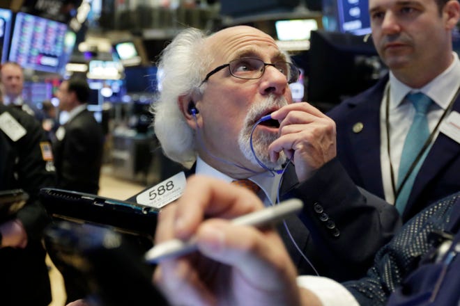 Trader Peter Tuchman works on the floor of the New York Stock Exchange, Tuesday, May 29, 2018. U.S. stocks are opening lower, following sharp drops in Europe triggered by political uncertainty in Italy. (AP Photo/Richard Drew)