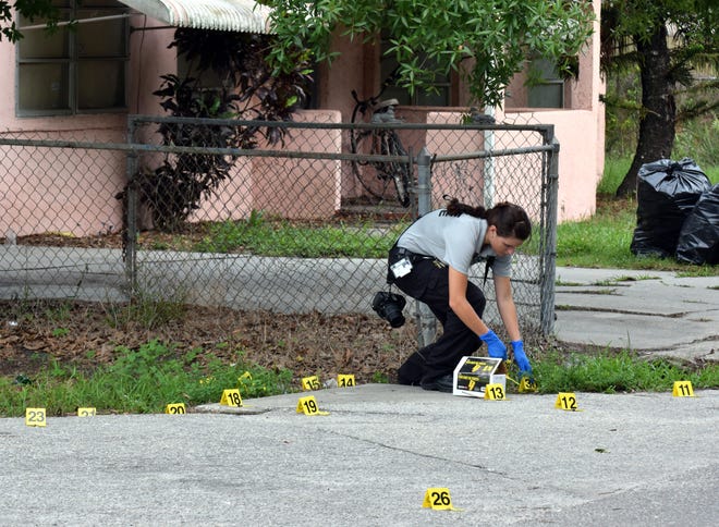 Sarasota County investigators investigated two crime scenes Tuesday, May 29, 2018, about 500-feet apart on 32nd Street beginning at Leonard Point Avenue. [Herald-Tribune staff photo / Carlos R. Munoz]