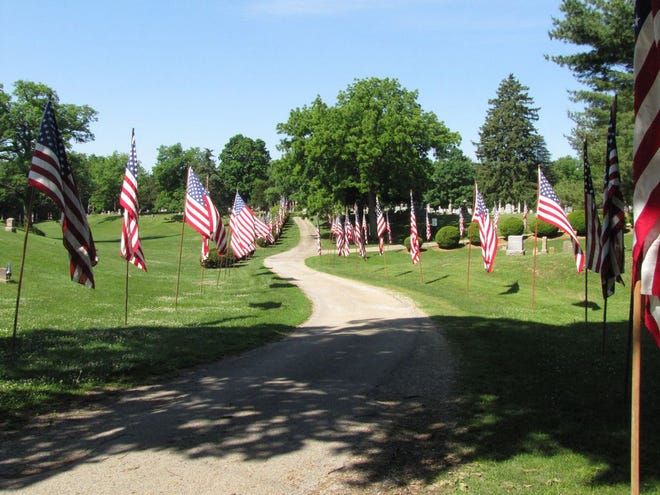 Flags line the drive of Oak Hill Cemetery in Lewistown on Memorial Day. Some graves also had a flag placed next to it, signalling that the individual had been a veteran. Services started at the Lewistown High School auditorium and included music by the high school’s band and speaker Lt. Col. Cory Wise.