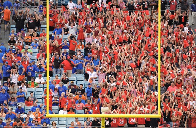 Florida fans started clearing out of the stadium while Georgia fans stayed to savor a 42-7 Bulldogs victory last year at EverBank Field. [Bob Self/Florida Times-Union]