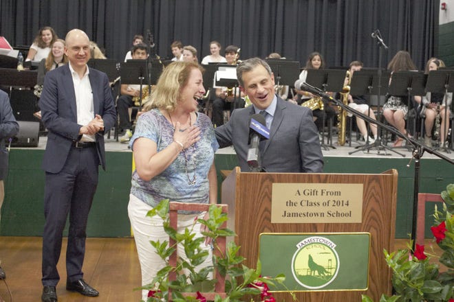 Charlene Tuttle, sixth-grade science and social studies teacher at Lawn School in Jamestown, is announced as Rhode Island Teacher of the Year 2019 on Wednesday morning by Rhode Island first gentleman Andy Moffit, right, and Commissioner of Elementary and Secondary Education Ken Wagner. [PETER SILVIA PHOTO]