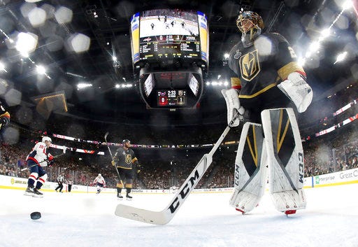 Vegas Golden Knights goaltender Marc-Andre Fleury, right, stands in the crease after Washington Capitals center Lars Eller, left, scored on him during the first period in Game 2 of the NHL hockey Stanley Cup Finals on Wednesday, May 30, 2018, in Las Vegas. (Bruce Bennett/Pool via AP)
